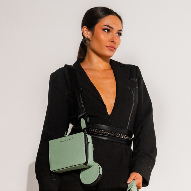 Fashion model wearing front side mint sage vegan leather dog walking bag with detachable doggie treat pouch