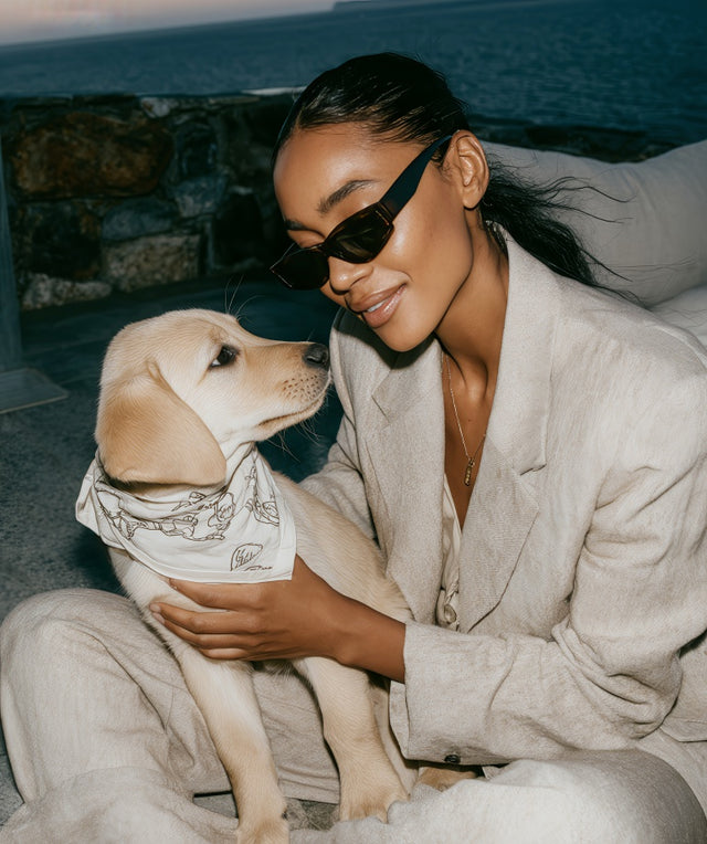 women with puppy looking at her 