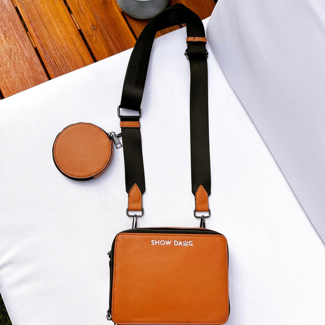Flat lay front side buffalo caramel vegan leather dog walking bag with detachable doggie treat pouch 